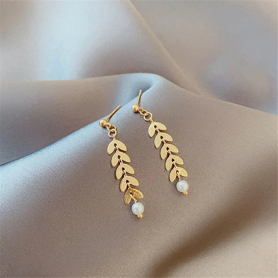 Conjunto bañado en oro de 18 quilates con perla