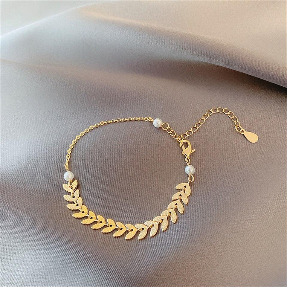 Conjunto bañado en oro de 18 quilates con perla