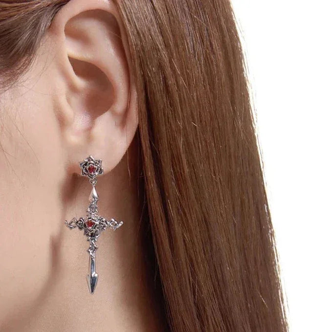 Par de pendientes de cruz rosa