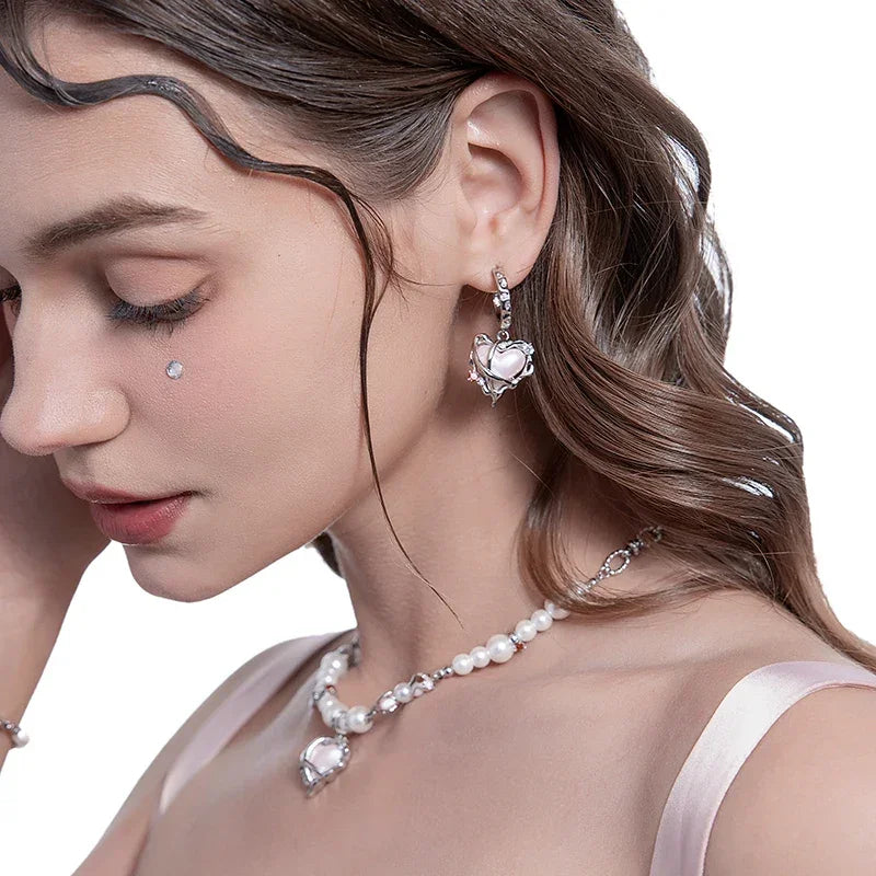 Par de pendientes de corazón de belleza