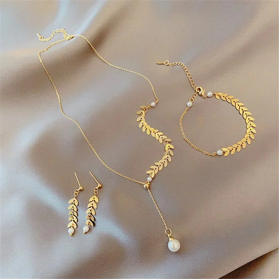 Conjunto bañado en oro de 18 quilates con perla
