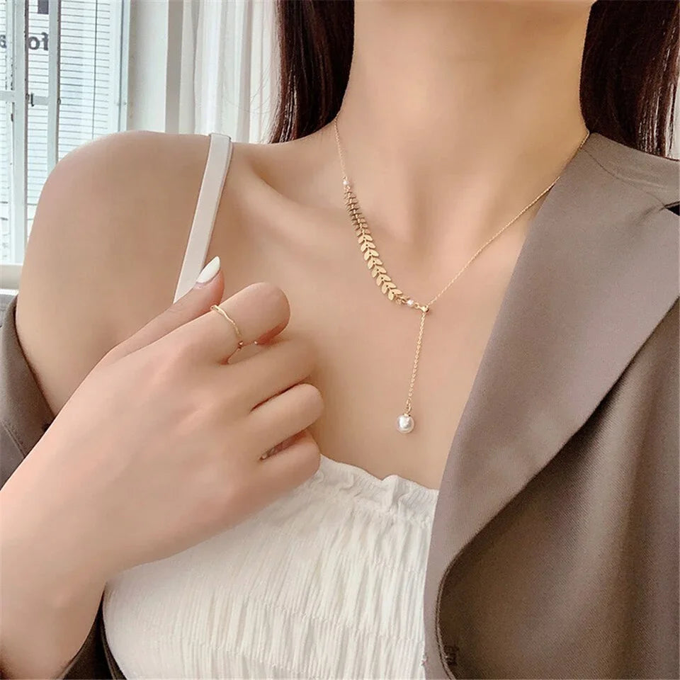 Conjunto bañado en oro de 18 quilates con perla