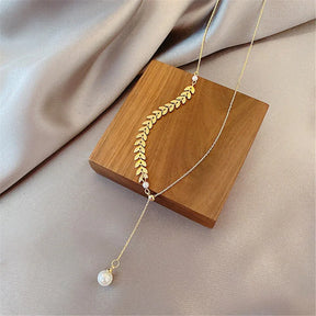 Conjunto bañado en oro de 18 quilates con perla