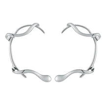 Par de pendientes brillantes con protección para las orejas