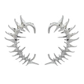 Par de pendientes punk con protección para las orejas y pinchos