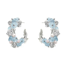 Par de pendientes florales