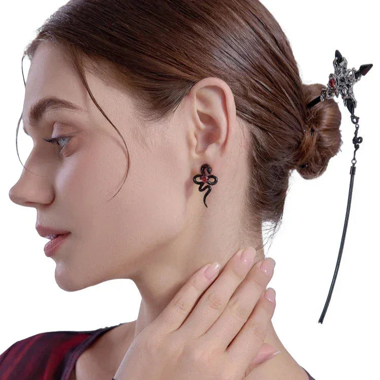 Par de pendientes de veneno